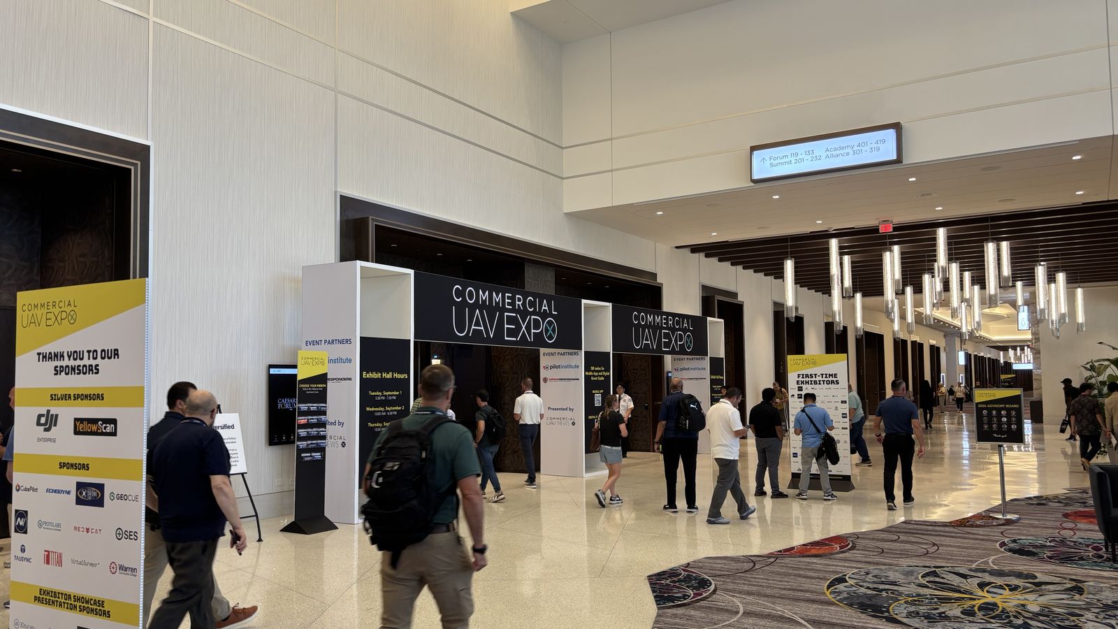 Entrance to Commercial UAV Expo 2026 with attendees entering the event.