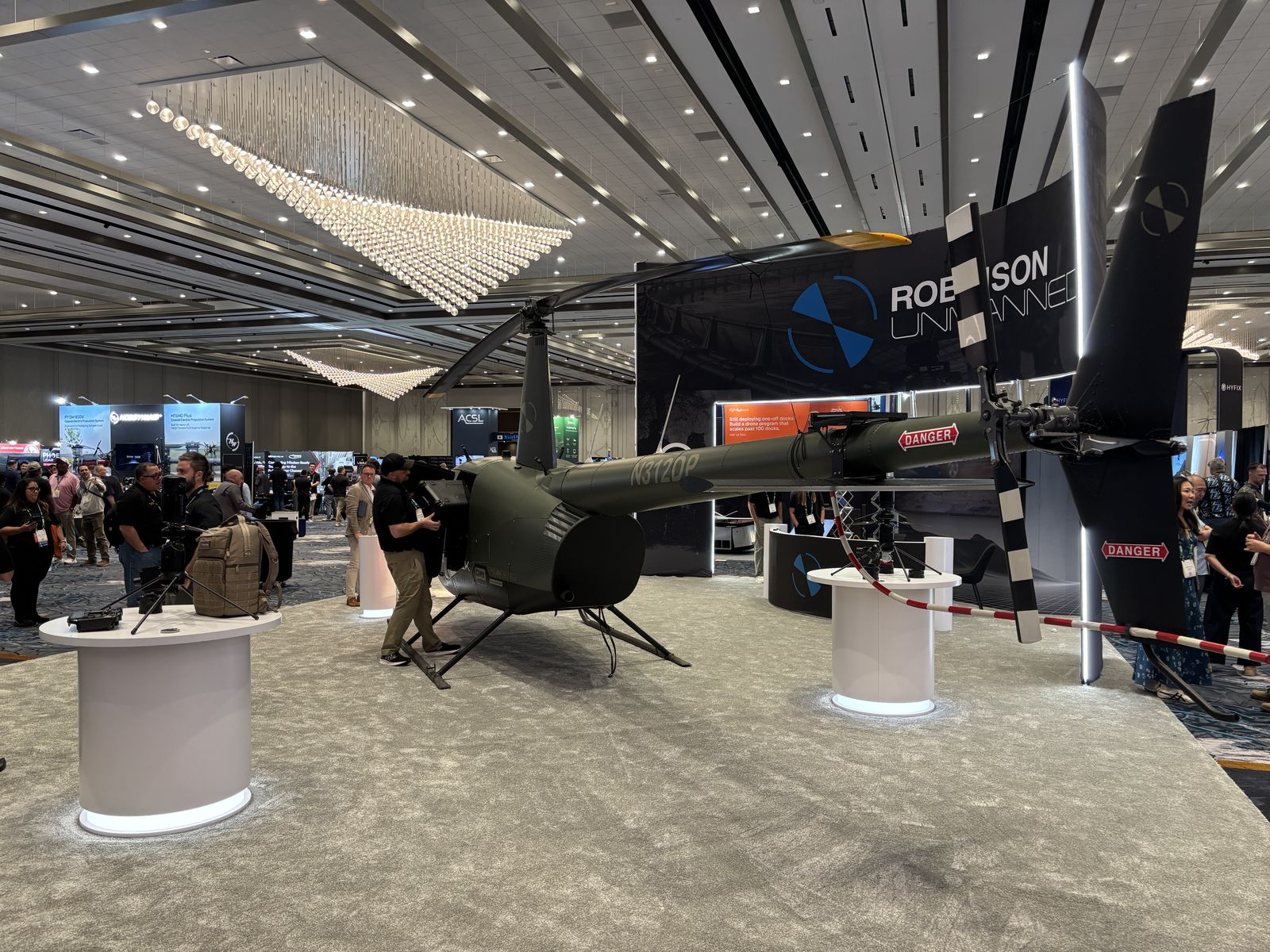 Large unmanned helicopter displayed on the Commercial UAV Expo exhibition floor.